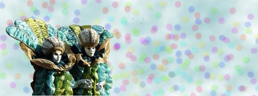 venice carnival, two figurines at colorful polka dots Background