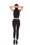 back view of slim woman in black pants