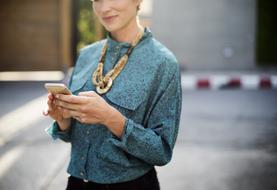 a business woman holding a phone