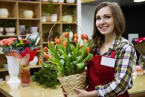 cheerful girl at work in flower Shop