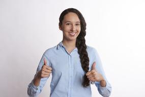 smiling woman with thumbs up