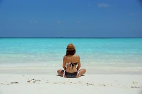 Woman om white sand sea