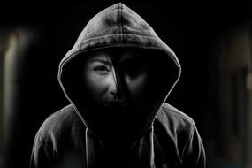 Black and white portrait of a woman in hood