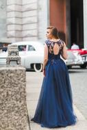 Girl in long blue Dress, back view