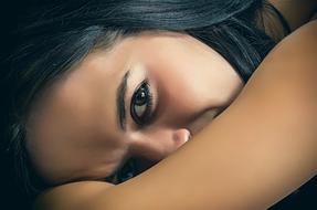 expressive eyes of a young brunette close up