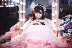Asian model in airy dress on mirror background