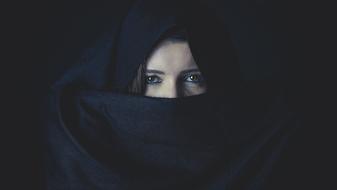 sad woman with covered face