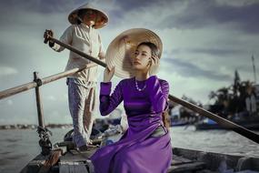 young asian Lady posing on traditional rowing Boat