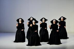 girls in black clothes dancing in the theater