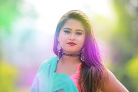 portrait of a girl in bright clothes on a blurred background