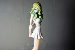Figurine of the girl in white dress, with the colorful hair