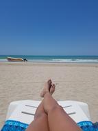 tanned female Feet on beach