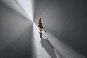 girl with a guitar in a tunnel