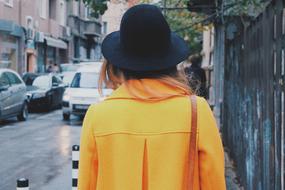 woman in yellow coat outdoor