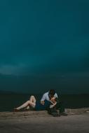 young Couple in love kissing at sea