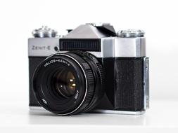 Beautiful, classic, retro, black and grey "Zenit" camera at white background