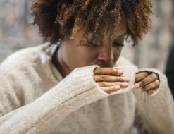 African woman with coffee