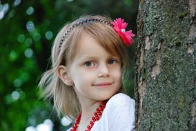 portrait of cute girl and tree