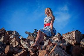 Girl stone blue sky