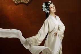 Asian woman in white robe