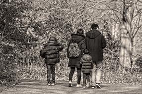walking around family in the park