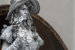 Beautiful, shiny sculpture of the woman with the flower, in Vienna, Austria