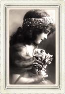 Black and white portrait of a girl in wreath, in the frame