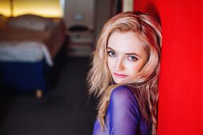 Blonde Girl at red wall