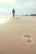 Footprints of Woman on Beach