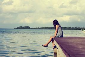 girl on the sea pier