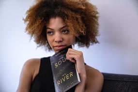 thinking woman with a book