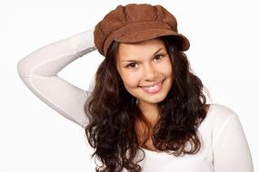 Beautiful happy woman in brown cap