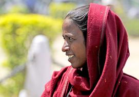 Indian woman covered with red fabric