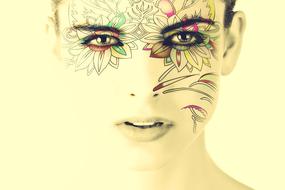 portrait of a woman with tattooed face