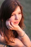 portrait of a pensive girl on a blurred background