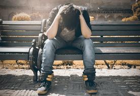 sad fashion guy on the bench