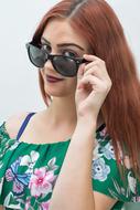 portrait of a red hair woman with sunglasses