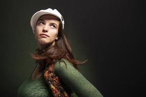 young girl in Green clothing and white cap, Portrait