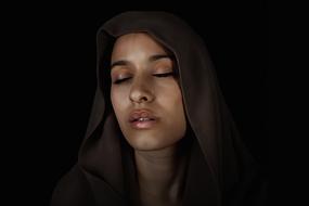 girl with closed eyes in a hood