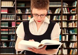 woma reading a book in library