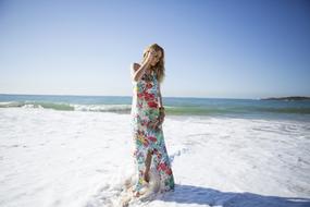 photo of a girl in a floral dress on the beach in Itaparica, Brazil