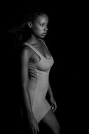 monochrome photo of a dark-skinned model in a long T-shirt