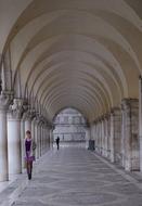 Woman in arch architecture in Venice