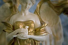 Beautiful, gold and white angel figure in Art Nouveau