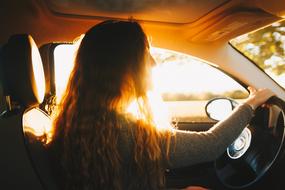 Girl in car sun