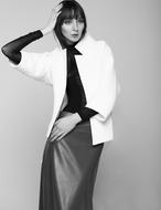posh woman posing in designer clothing