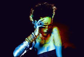young girl with painted body at darkness