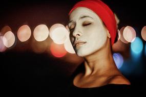 portrait of a beautiful girl in a white mask