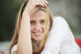 happy young woman with long blond hair