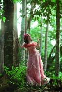 Beautiful Woman in green Forest
